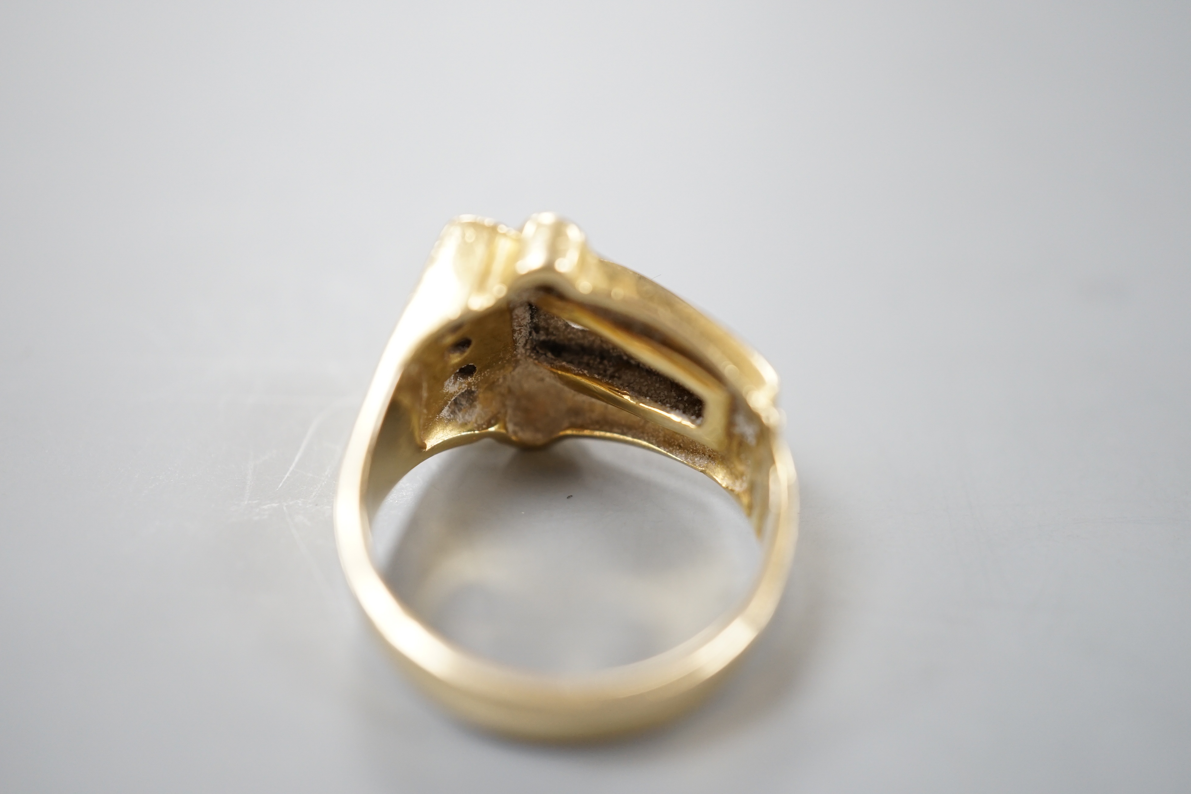 A 1950's yellow metal and graduated eight stone diamond set dress ring, size P/Q, gross 10 grams.